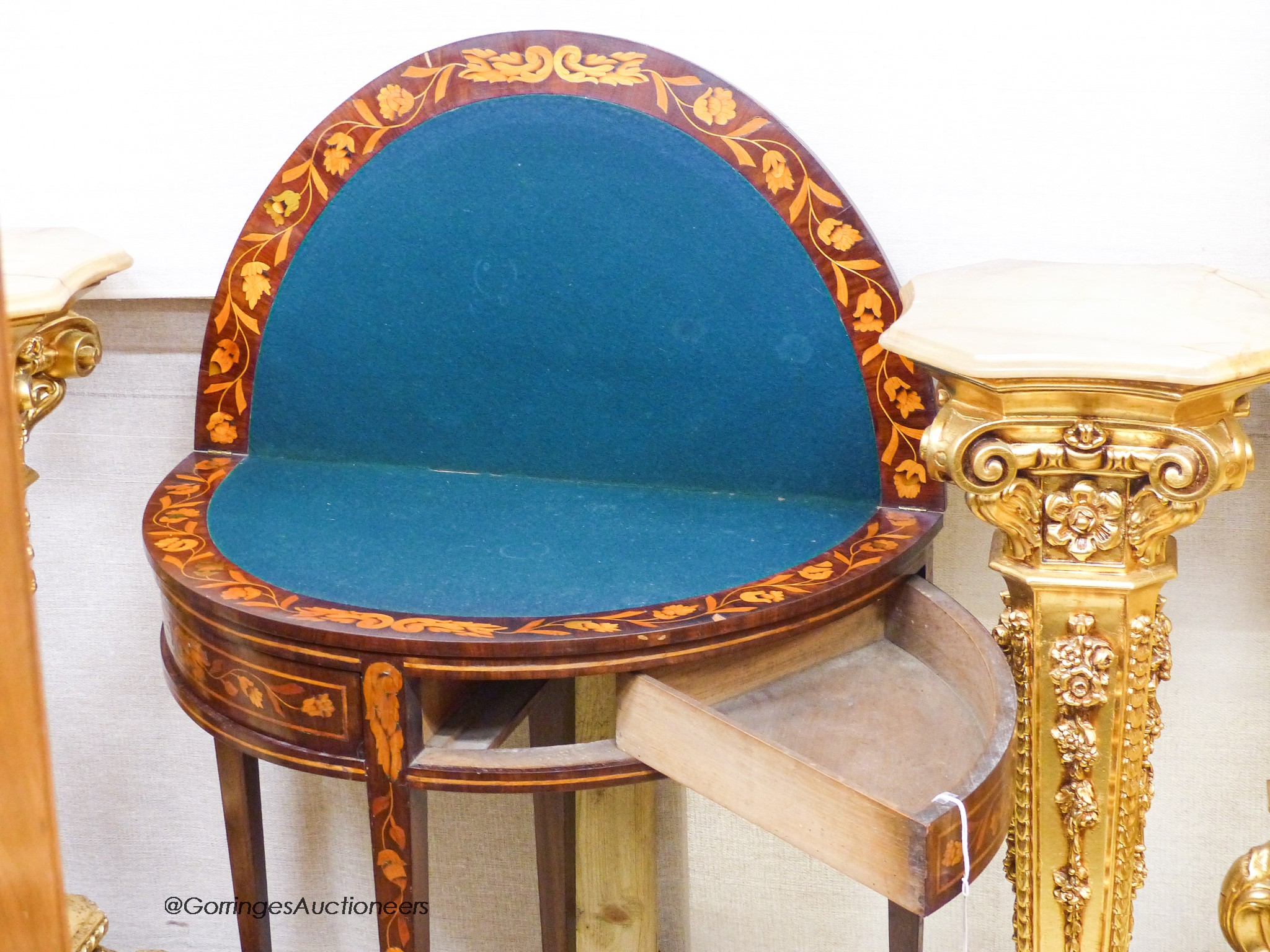 An early 19th century Dutch floral marquetry walnut D shaped folding card table, width 80cm, depth 45cm, height 76cm